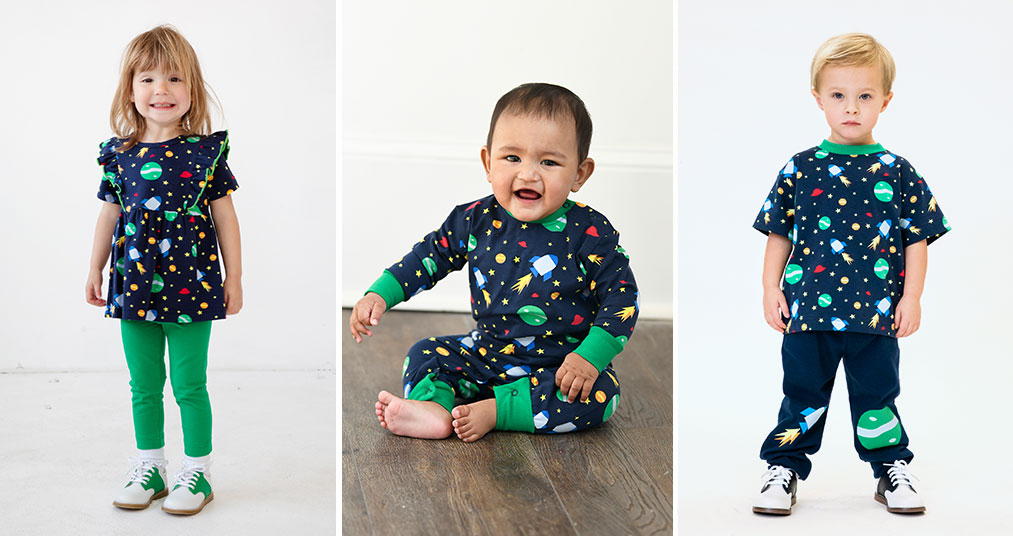 Three children wearing garments from our Outer Space pattern line