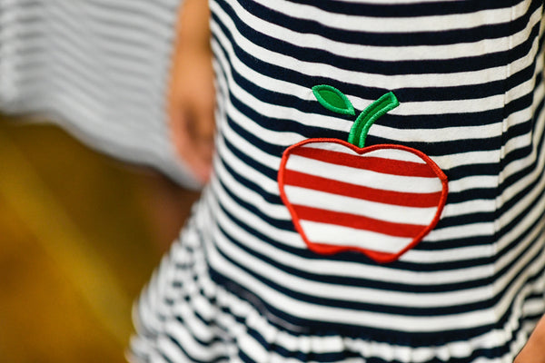 black and white stripe dress with apple decoration
