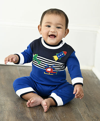 toddler boy in a navy longall with appliqués