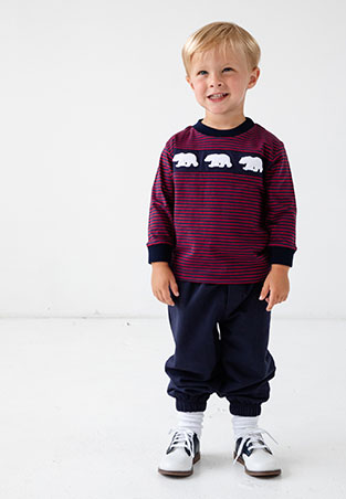 young boy wearing red and blue stripe long sleeve shirt with polar bear