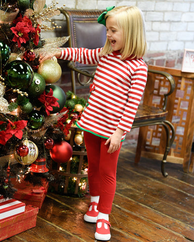 young girl in red and white stripe top with flower and matching leggings